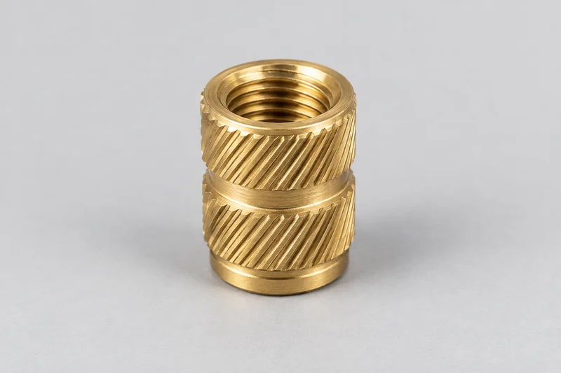 AI-generated knurled plastic-insert appearance reference with an internal thread; not a process diagram or supplied-product photograph